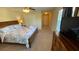 Bedroom with carpet, ceiling fan, and a view to the hall at 8991 Cuban Palm Rd, Kissimmee, FL 34747