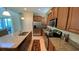 Modern kitchen featuring stainless steel appliances and granite countertops at 8991 Cuban Palm Rd, Kissimmee, FL 34747