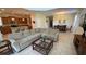 Open concept living and dining area with tile floors, neutral walls, and ample space for entertaining at 8991 Cuban Palm Rd, Kissimmee, FL 34747