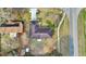 Overhead view of the house, featuring a brown roof and a lawn with two palm trees at 96 Pecan Dr, Ocala, FL 34472