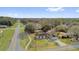 An aerial view of the home with a manicured lawn and landscaping at 96 Pecan Dr, Ocala, FL 34472