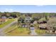 Aerial view of the home with a well-manicured lawn and lush landscaping at 96 Pecan Dr, Ocala, FL 34472
