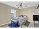 Cozy bedroom with natural light and ceiling fan at 96 Pecan Dr, Ocala, FL 34472