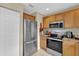 Well-lit kitchen features stainless steel appliances and light wood cabinets at 96 Pecan Dr, Ocala, FL 34472