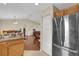 Open-concept kitchen with stainless steel appliances and views into living and dining areas at 96 Pecan Dr, Ocala, FL 34472