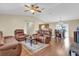 Open-concept living room with hardwood floors, neutral paint, and comfortable seating at 96 Pecan Dr, Ocala, FL 34472