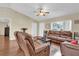 Inviting living room with ample natural light, hardwood floors, and cozy furnishings at 96 Pecan Dr, Ocala, FL 34472