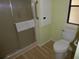 Clean bathroom with shower, toilet, and grab bars at 361 Wade Park Ct, Davenport, FL 33897