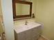Bright bathroom with light-colored walls, mirror, vanity, and modern fixtures at 361 Wade Park Ct, Davenport, FL 33897