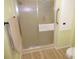 Bathroom with a convenient shower with sliding glass doors and safety grab bars at 361 Wade Park Ct, Davenport, FL 33897