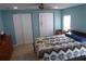 Serene bedroom featuring a large bed, soft natural light, and abundant closet space at 361 Wade Park Ct, Davenport, FL 33897
