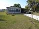 Charming single-story home featuring a covered carport and a well-maintained front yard with a cozy curb appeal at 361 Wade Park Ct, Davenport, FL 33897