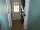 Convenient laundry room with washer and dryer units and access to the backyard at 361 Wade Park Ct, Davenport, FL 33897