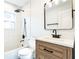 Stylish bathroom featuring modern vanity, mirror, new fixtures, and tiled shower with rainfall shower head at 1203 Baranova Rd, Ocoee, FL 34761