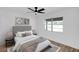 Light-filled bedroom featuring a comfortable bed, neutral decor, and a window with natural light at 1203 Baranova Rd, Ocoee, FL 34761