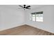 Bright bedroom with vinyl wood flooring and a window with natural light at 1203 Baranova Rd, Ocoee, FL 34761