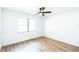 Vacant bedroom featuring wood-look floors, a ceiling fan, and a window at 1203 Baranova Rd, Ocoee, FL 34761