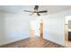 This bright bedroom has wood-look flooring and a ceiling fan at 1203 Baranova Rd, Ocoee, FL 34761