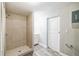 Bathroom with a stand-up shower, neutral paint, and wood look vinyl flooring at 1205 Flewelling Ave, Ocoee, FL 34761