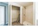 Bathroom area with a stand-up shower and closet featuring plumbing access at 1205 Flewelling Ave, Ocoee, FL 34761