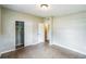 This cozy bedroom has neutral walls, closet and speckled floors at 1205 Flewelling Ave, Ocoee, FL 34761