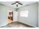 Bedroom featuring a window and doorway view of the updated kitchen at 1205 Flewelling Ave, Ocoee, FL 34761