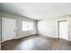 Bright living room with neutral walls, large window, and a door, offering a versatile living space at 1205 Flewelling Ave, Ocoee, FL 34761