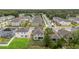 Overhead view of a neighborhood, featuring well-maintained homes, green lawns, and orderly street layout at 1212 Bear Oak Ln, Deland, FL 32720