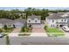 Aerial view of a two-story home with a three-car garage, brick driveway, and manicured front yard at 1212 Bear Oak Ln, Deland, FL 32720