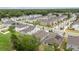 Birds-eye perspective showcasing a residential area with manicured lawns, varied architectural styles, and tree-lined streets at 1212 Bear Oak Ln, Deland, FL 32720
