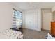 Bright bedroom with two beds, dresser, and a ceiling fan at 1212 Bear Oak Ln, Deland, FL 32720
