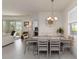 Bright dining room with modern decor, view of adjacent living room at 1212 Bear Oak Ln, Deland, FL 32720