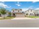 Inviting two-story home featuring a three-car garage and well-manicured lawn in a desirable neighborhood at 1212 Bear Oak Ln, Deland, FL 32720