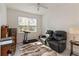 Flex space featuring an exercise machine, a seating area and a bright window at 1212 Bear Oak Ln, Deland, FL 32720