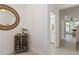 Bright entryway with decorative mirror and view of a bathroom and the living room at 1212 Bear Oak Ln, Deland, FL 32720