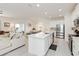 Open-concept living space with a bright kitchen, dining area, and a comfortable living room perfect for modern living at 1212 Bear Oak Ln, Deland, FL 32720