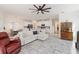 Open living space with kitchen, dining, and living room, featuring tile floors and modern furnishings at 1212 Bear Oak Ln, Deland, FL 32720