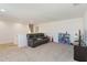 Spacious loft area with carpet, perfect for relaxing or entertaining, features a comfortable sofa at 1212 Bear Oak Ln, Deland, FL 32720