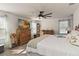 Bright main bedroom with a ceiling fan and light-filled windows offering a calming retreat at 1212 Bear Oak Ln, Deland, FL 32720