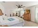 This main bedroom with carpet and large windows provides a serene and comfortable private retreat at 1212 Bear Oak Ln, Deland, FL 32720