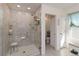Updated bathroom with glass-enclosed tile shower, bench, and multiple shower heads at 1212 Bear Oak Ln, Deland, FL 32720