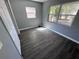 The bedrooms have fresh paint and laminate floors at 1219 Dewey Ave, Orlando, FL 32808