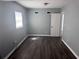 This bedroom features gray walls, and dark laminate flooring at 1219 Dewey Ave, Orlando, FL 32808