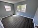 The bedroom has new laminate flooring and fresh paint at 1219 Dewey Ave, Orlando, FL 32808