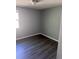 Bedroom features gray walls, gray floors and one window at 1219 Dewey Ave, Orlando, FL 32808