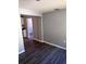 Living room showing gray walls, gray floors, and the doorway to the kitchen at 1219 Dewey Ave, Orlando, FL 32808