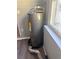 Gray water heater on a gray floor at 1219 Dewey Ave, Orlando, FL 32808