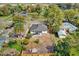 An aerial view showing a house with a yard, surrounding houses, and trees at 1240 Moton Ave, Sanford, FL 32771