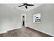 Bright bedroom with neutral walls and flooring features a ceiling fan and natural light at 1240 Moton Ave, Sanford, FL 32771