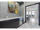 Modern bar area with sleek cabinetry, countertops, and an open doorway into the conference room at 1297 Grand Traverse Pkwy, Reunion, FL 34747